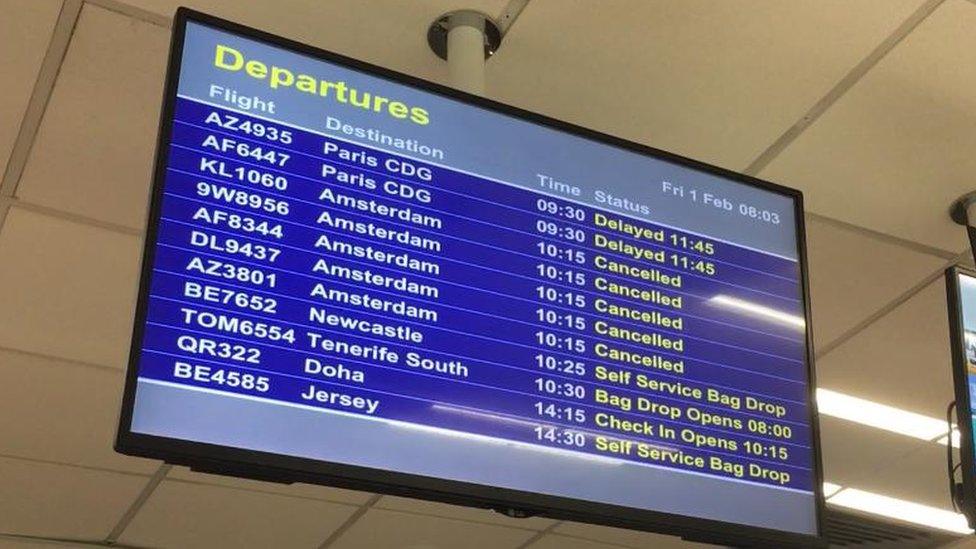 A flight information board showing cancellations