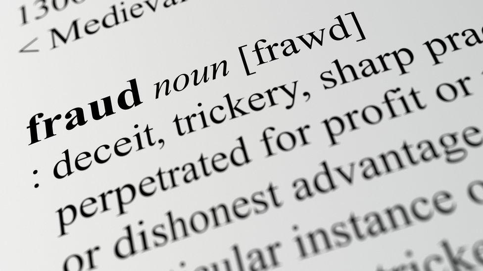 close-up of definition of fraud