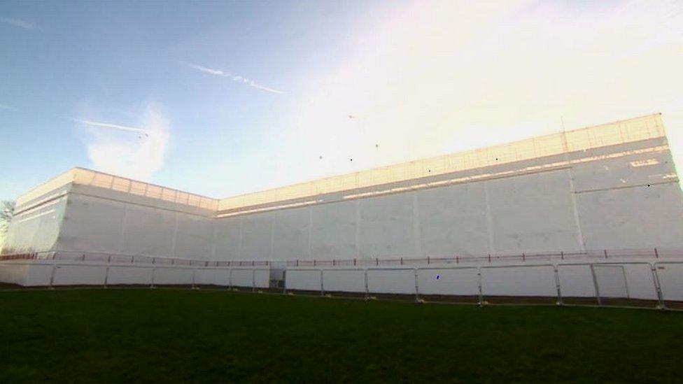 Haygrove School surrounded in scaffolding and wrapped in white plastic.