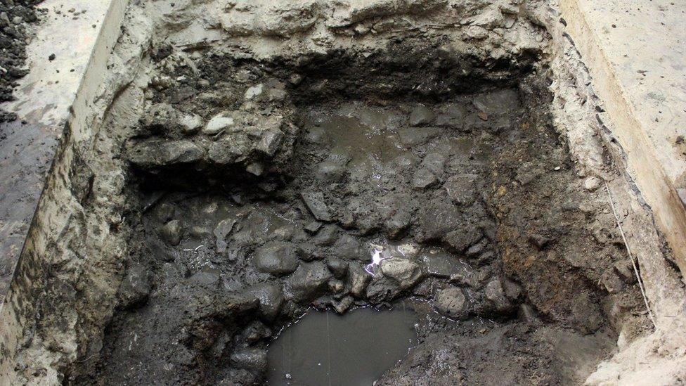 Roman street surface or yard, discovered in a test pit inside the Debenhams building