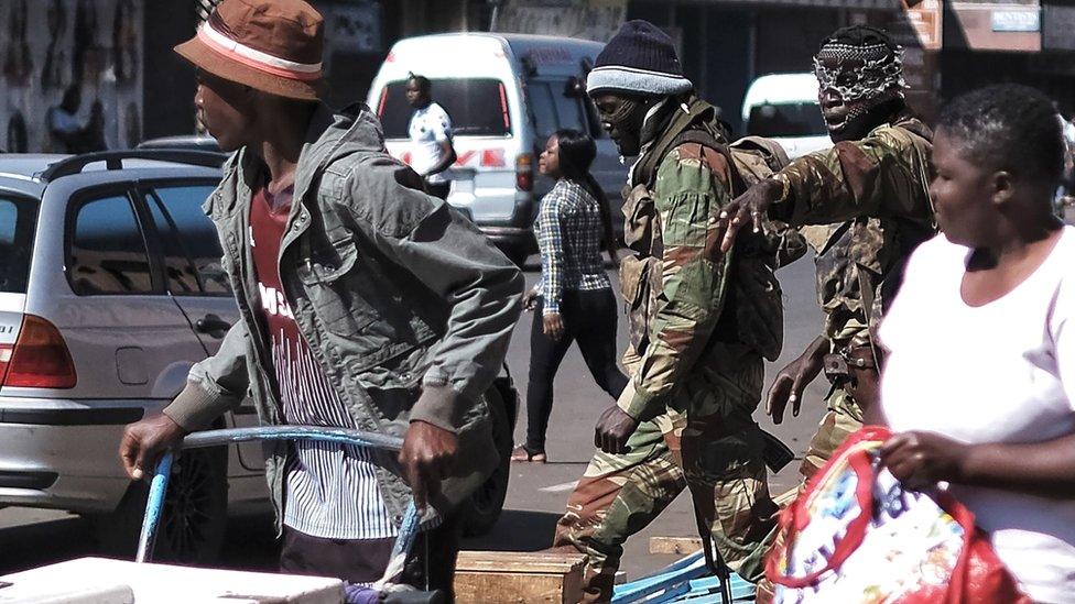 Soldiers gesturing to people in Harare, Zimbabwe - 2 August 2018