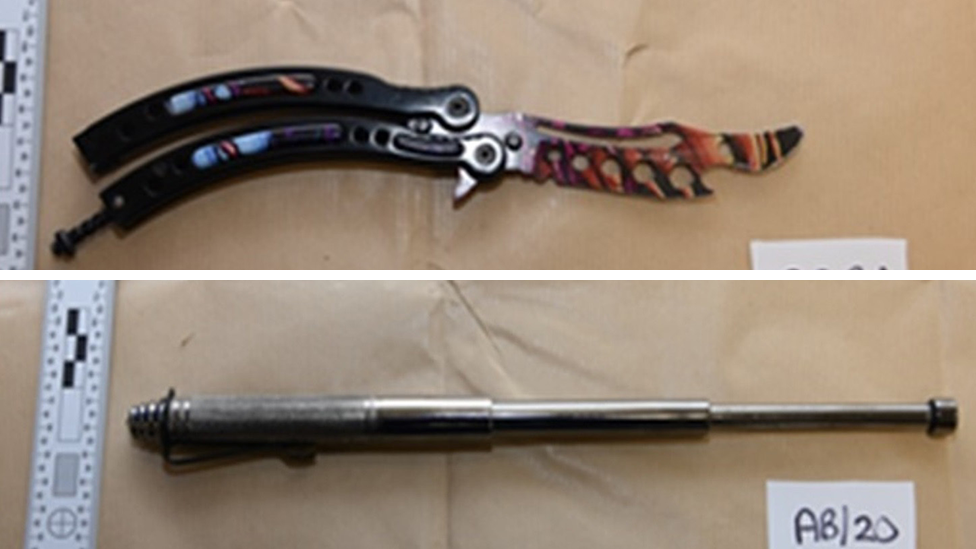 A composite image showing a "butterfly" knife at the top with a black handle and black, brown, yellow and red patterned curved blade. Below it is a dull grey metal telescopic baton