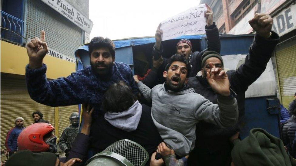 Activists of Kashmiri separatist groups shout slogans from police vehicle after they were detained during a protest march on Human Rights Day in Srinagar, the summer capital of Indian Kashmir, 10 December 2017