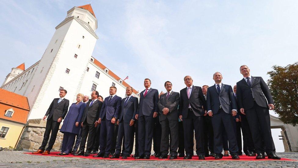 Heads of state and government of the 27 EU member countries gather for a group photo call at the Bratislava castle during the EU summit on Friday