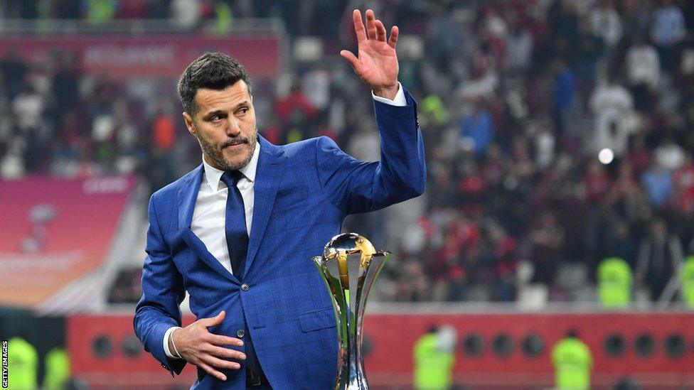 Former Brazil goalkeeper Julio Cesar with the Club World Cup trophy