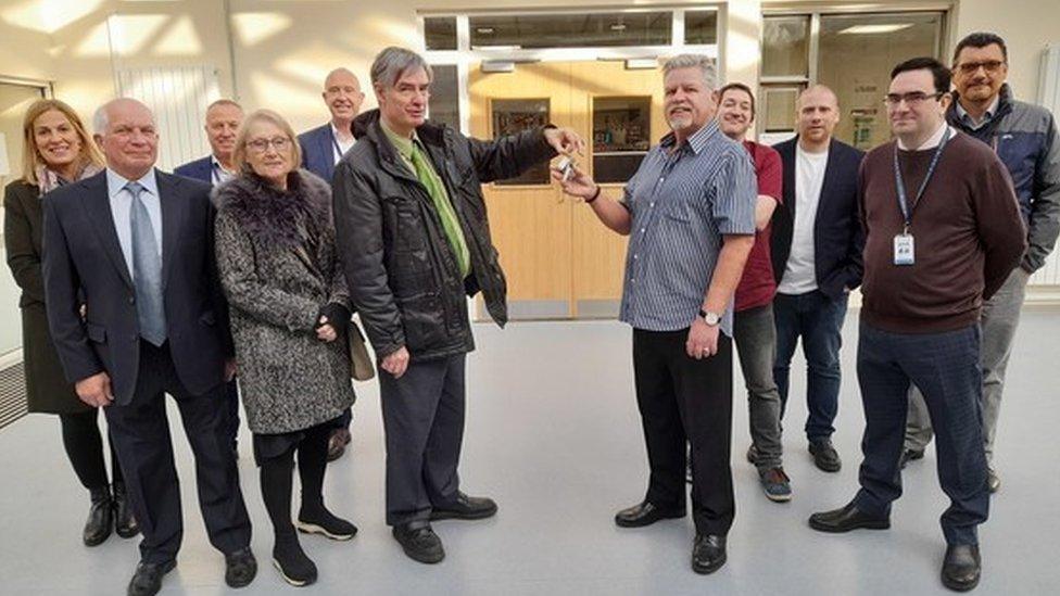 Leader of Basildon Council, Cllr Andrew Baggott (left) handing over the keys to the newly refurbished Laindon Community Centre to Chairman of the Committee, David Kerr.