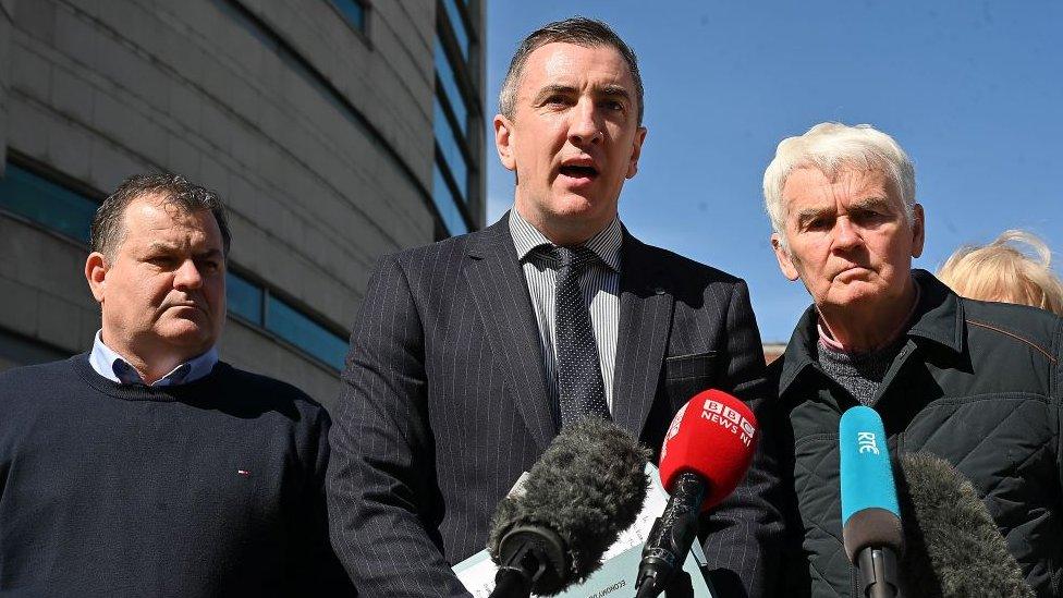 Solicitor Gavin Booth outside court with McKearney and Fox family members