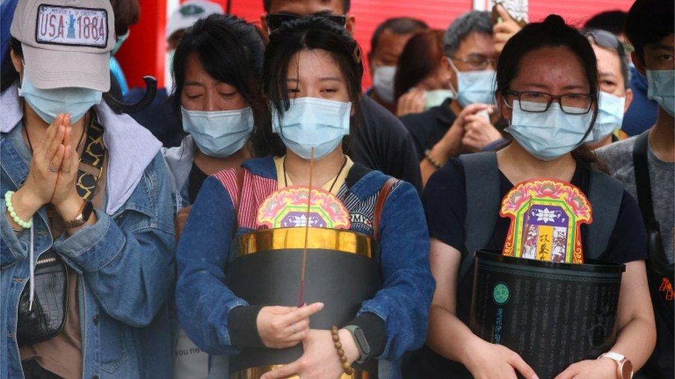 Relatives of the victims grieve near the site a day after the deadly train derailment at a tunnel north of Hualien, Taiwan April 3, 2021.