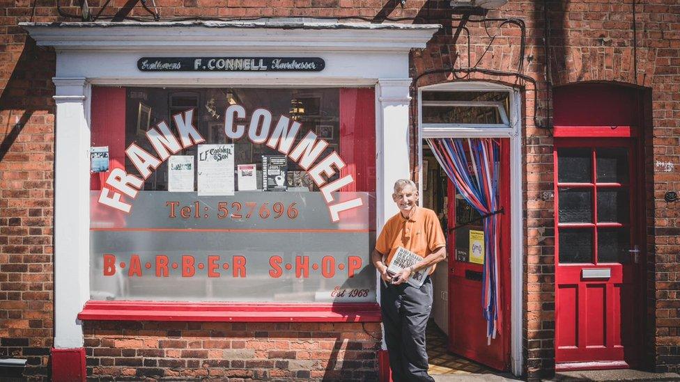 Frank Connell outside his shop on Burton Road, Lincoln