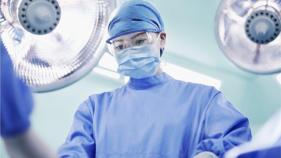 Surgeon in operating theatre