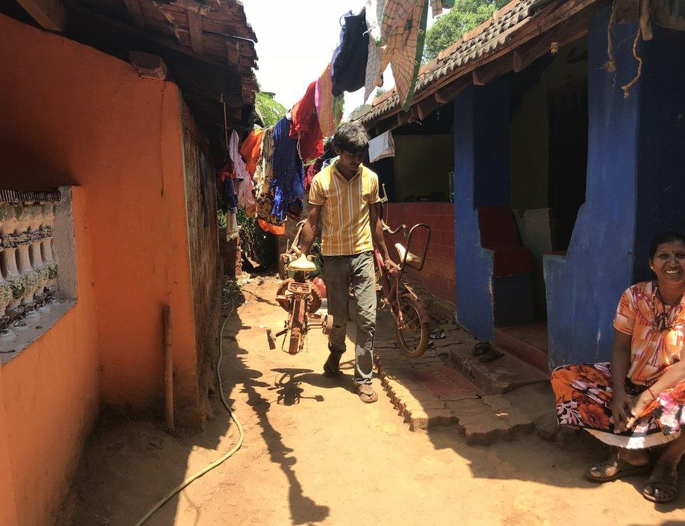 A man walks down a street in Sonshi