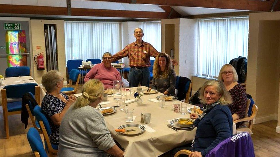 People sat around the table at support group