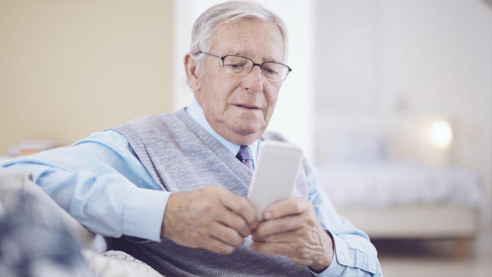 Older man using a smartphone