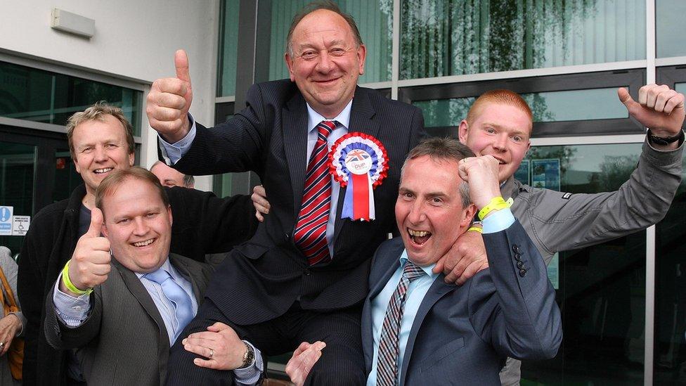 The DUP's William Irwin celebrates with party colleagues after his election in Newry and Armagh