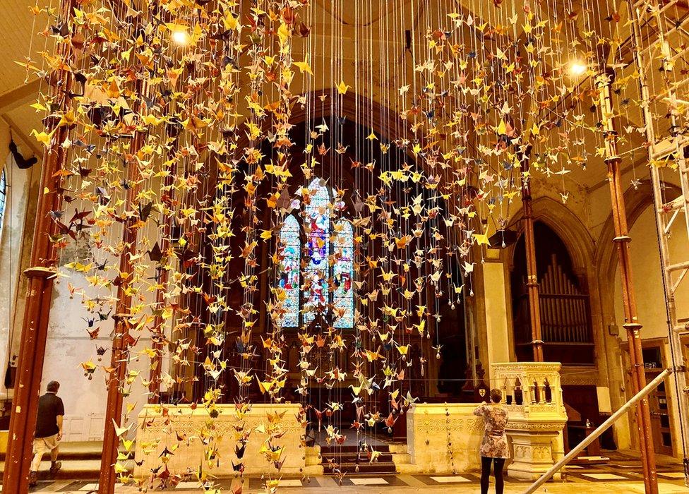 Thousands of paper cranes had been hand-folded to represent those who have died