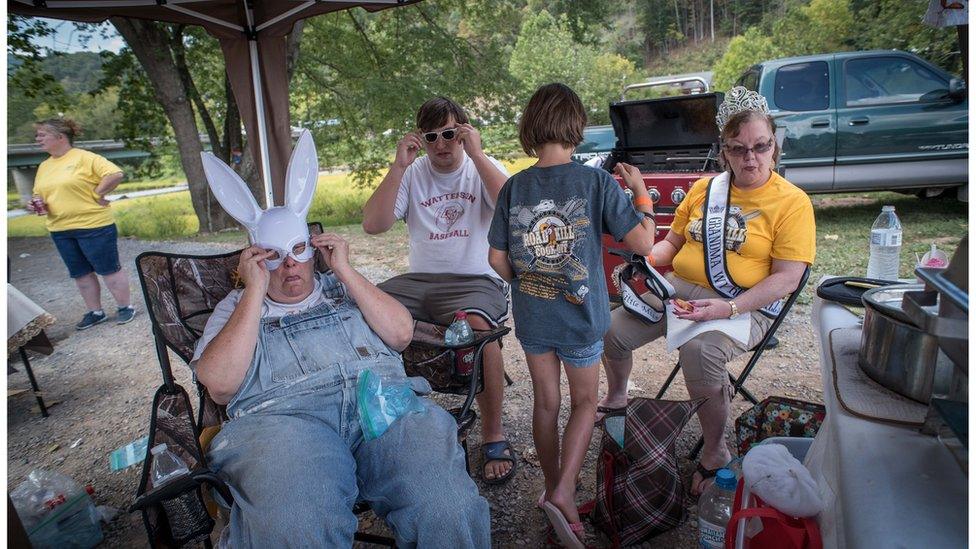 People relaxing on chairs.