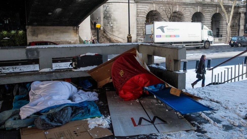 Bedding belonging to homeless person under a bridge in London