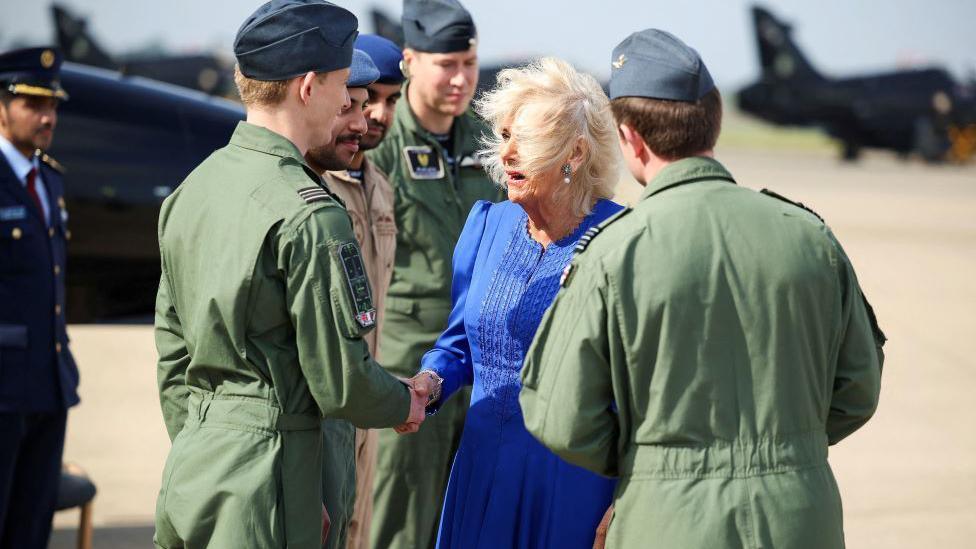 The Queen shaking hands and meeting RAF personnel during her visit 