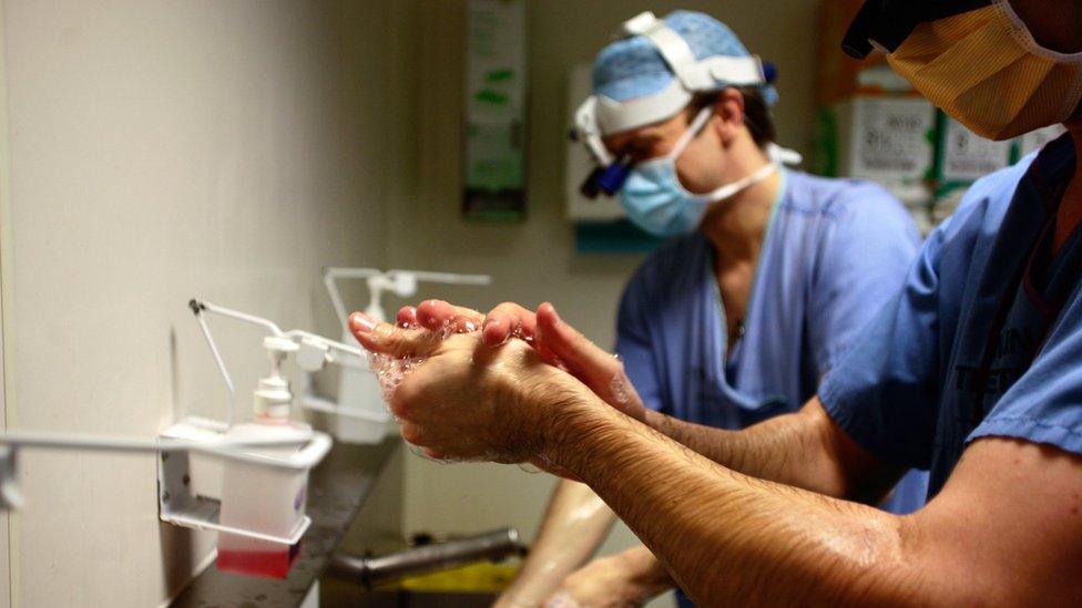 Surgeons washing their hands