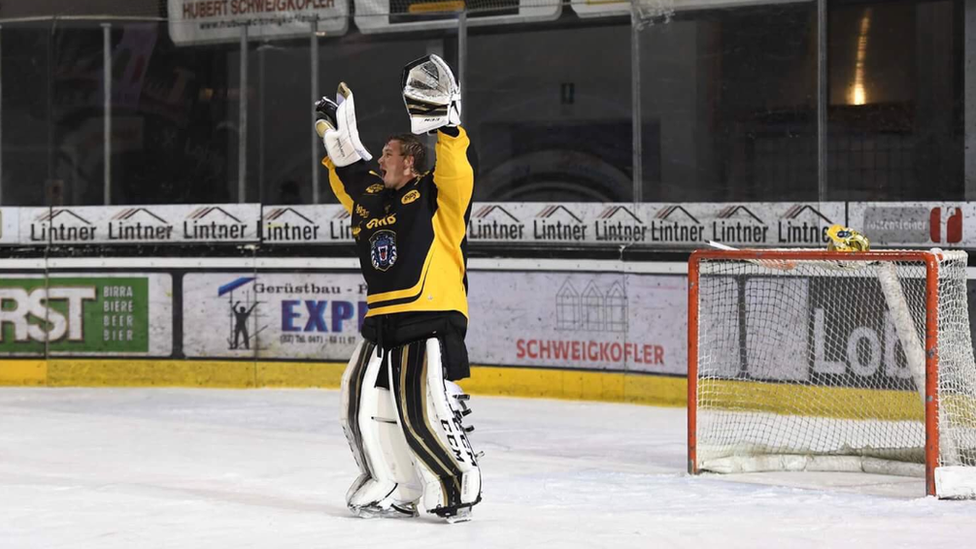This is a photo of the Nottingham Panthers goal keeper celebrating as the team scored the winning goal.