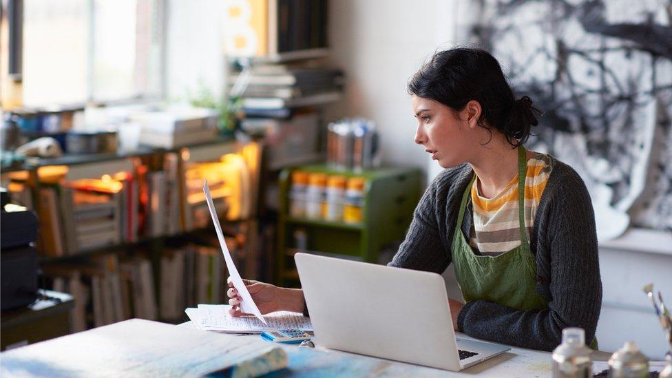 Woman sitting at laptop