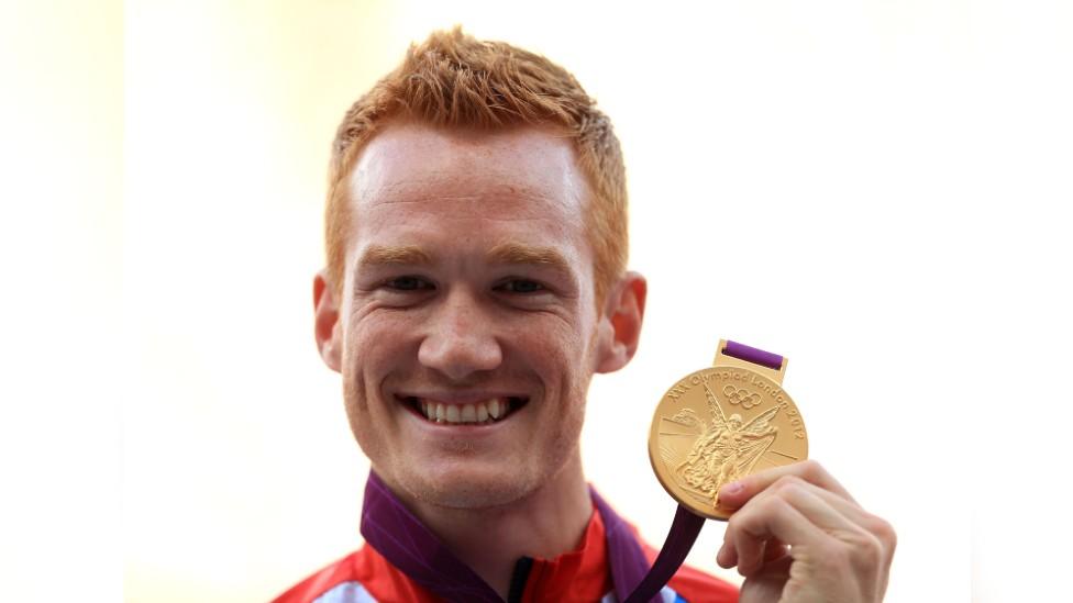 Greg Rutherford with Olympic gold medal