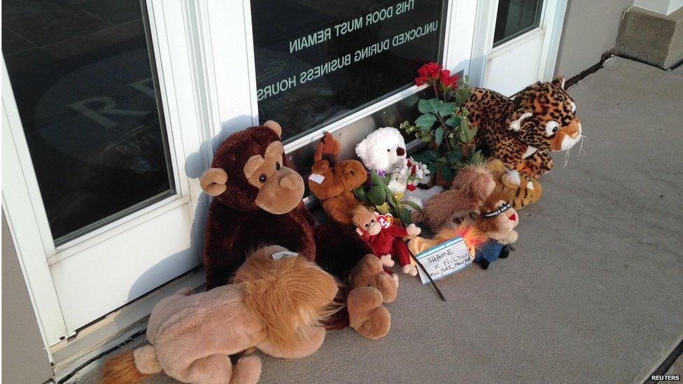 Stuffed animals left by protesters block the doorway of River Bluff Dental clinic after the killing of a famous lion in Zimbabwe, in Bloomington, Minnesota July 28, 2015
