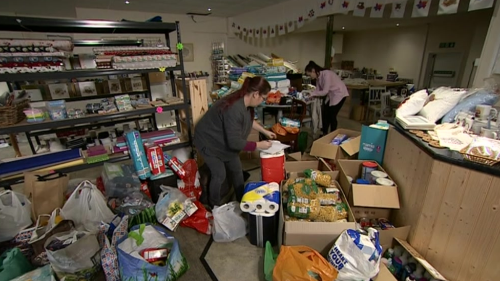 People packing food in to bags