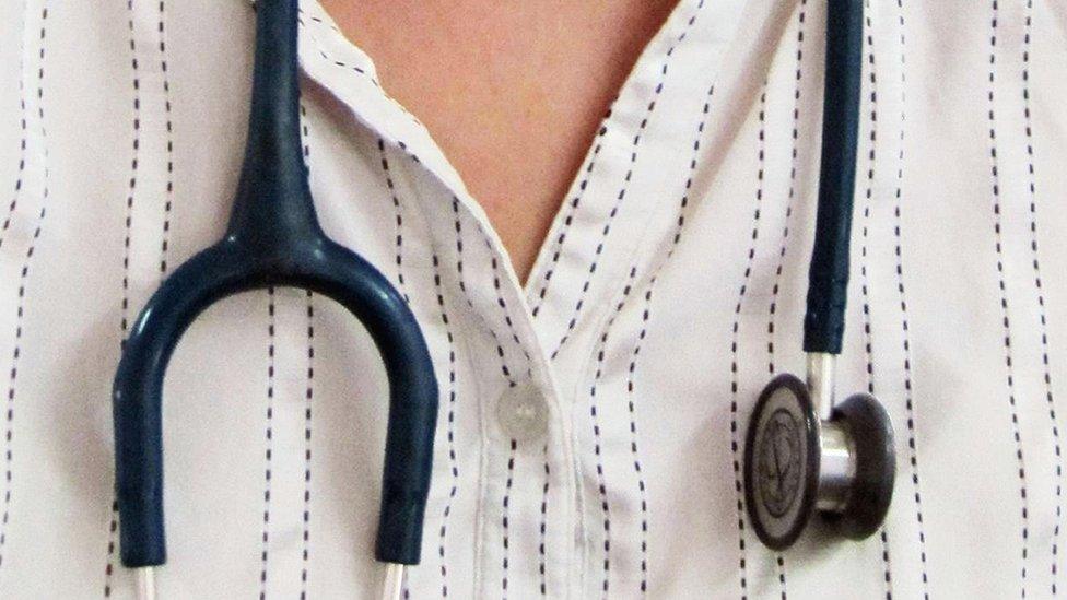 Consultant with stethoscope around neck