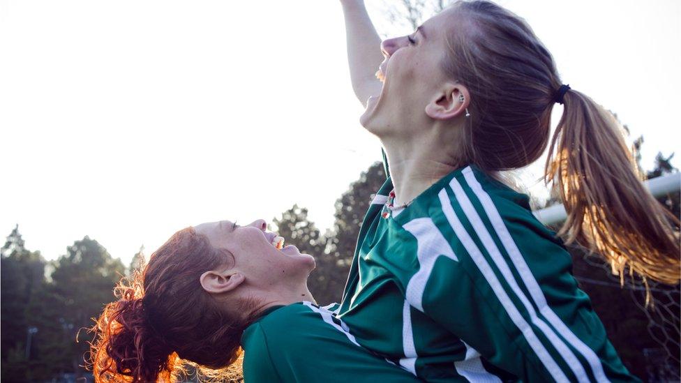 two women celebrate