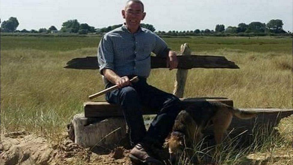 The late Roger Crawford sits on the original Buck Beck Beach Bench he helped build in 2015