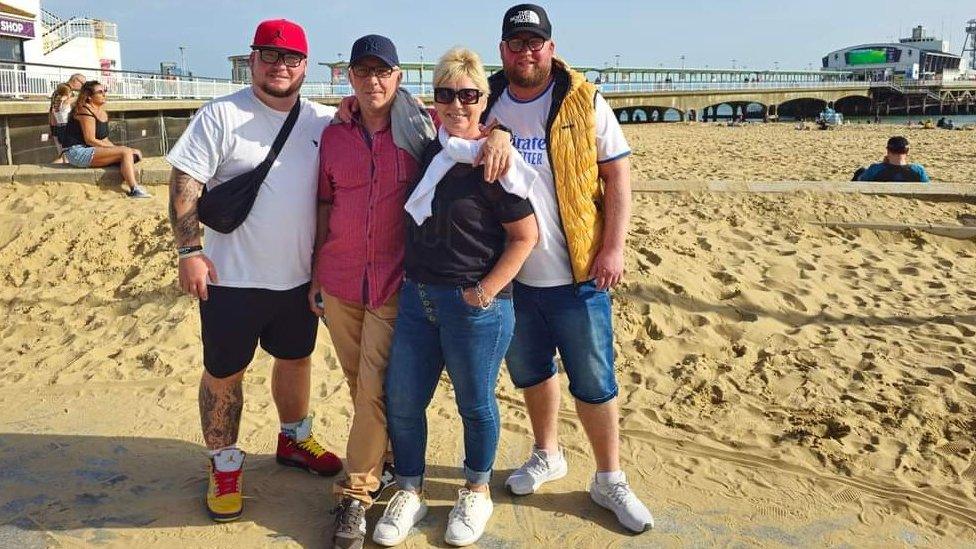 Michal Kaminski with his parents and younger brother Rafal