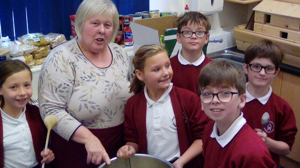 Baker Lynn Nolan with some pupils