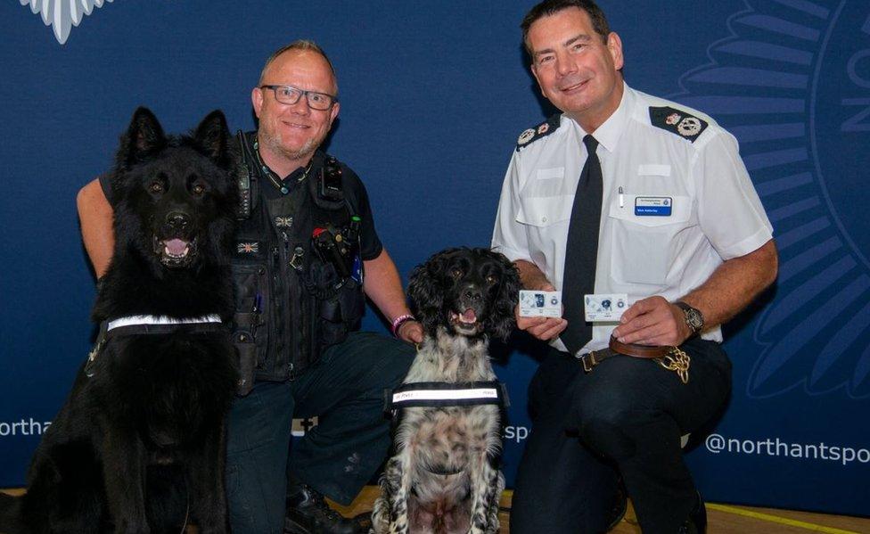 Chief Constable Nick Adderley (r) with PD Mac and PD Charlie's new warrant cards