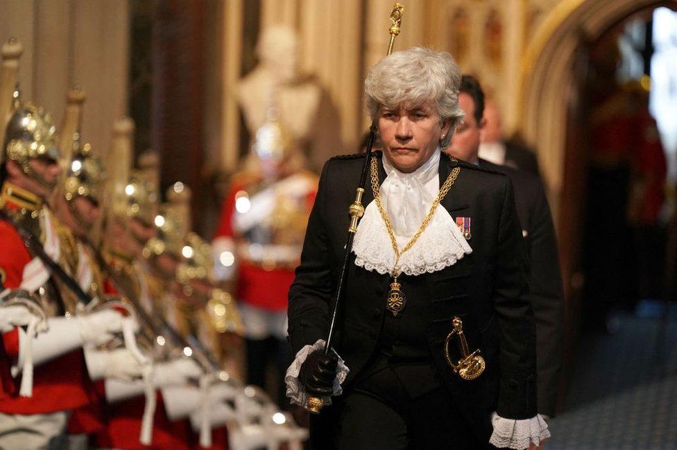 Lady usher of the Black Rod, Sarah Clarke walks through the Norman Porch for the State Opening of Parliament at the Houses of Parliament, on 10 May, 2022.