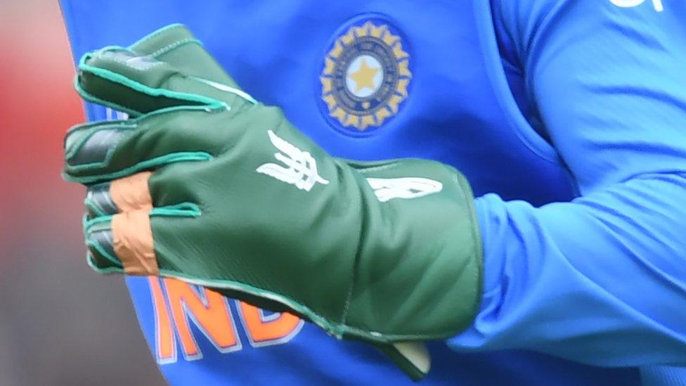 India's Mahendra Singh Dhoni fields during the 2019 Cricket World Cup group stage match between South Africa and India at the Rose Bowl in Southampton, southern England, on June 5, 2019