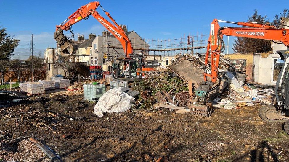 Demolition begins on the burnt homes in Wennington