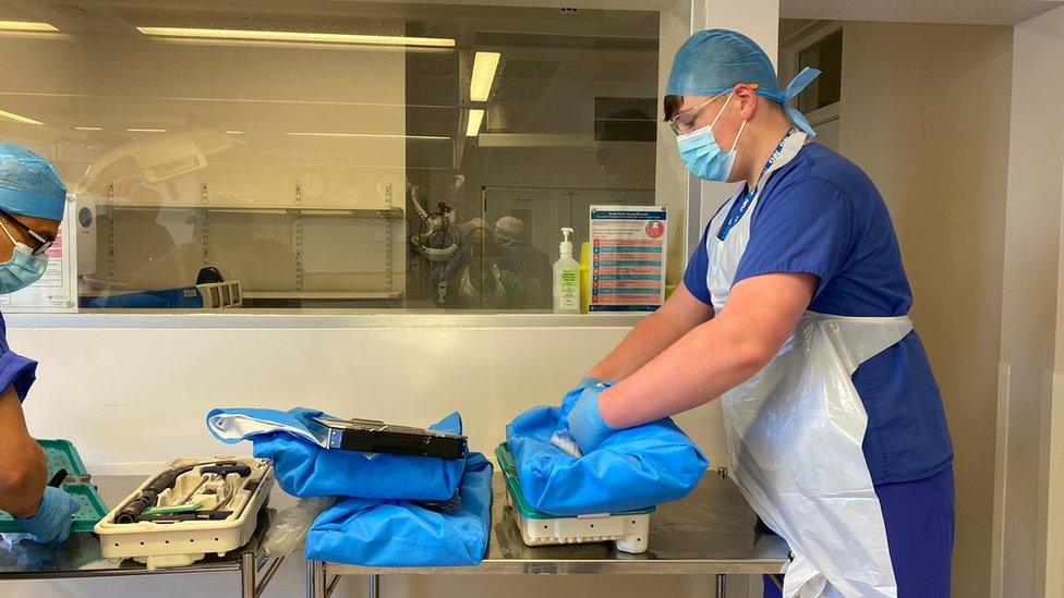 Ryan Davies assisting a healthcare colleague in hospital