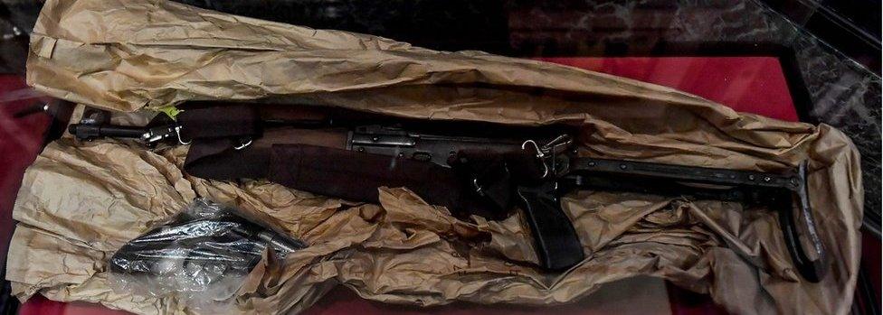 Weapons as pieces of evidence are displayed for a session in the trial regarding the terrorist attack at the Jewish Museum, at the courthouse in Brussels