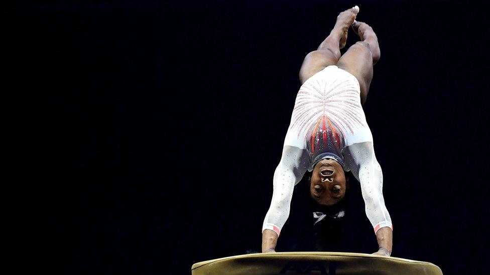 Simone Biles lands the Yurchenko double pike while competing on the vault