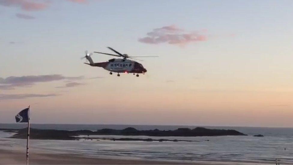 Coastguard helicopter over Rhosneigr Beach