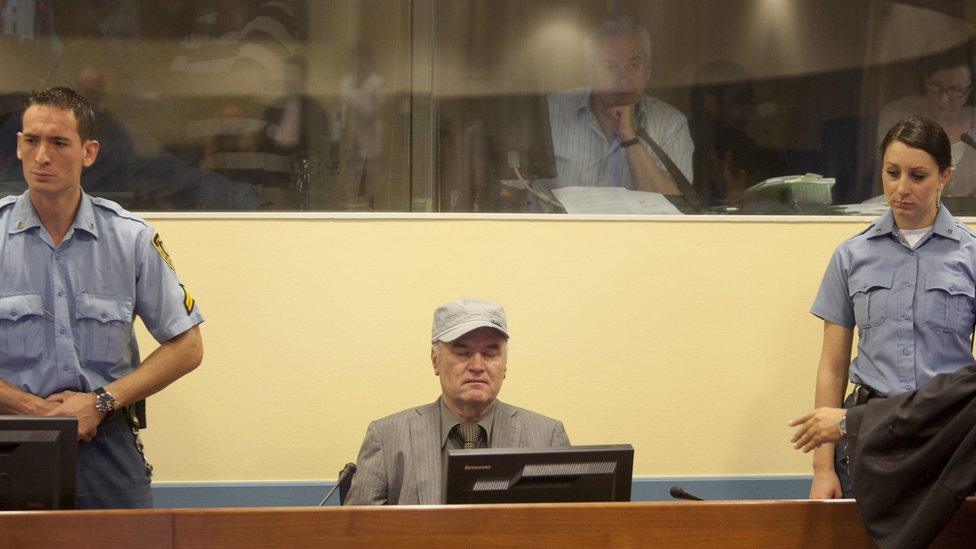 Former Bosnian Serb military leader Ratko Mladic takes his seat in the International Criminal Tribunal to face war crime charges on June 3, 2011