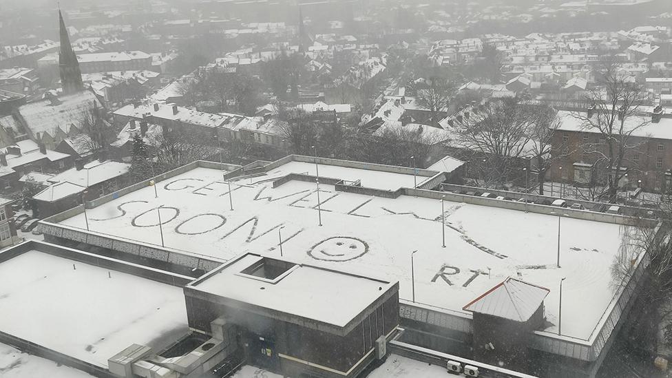 Get Well Soon message on roof