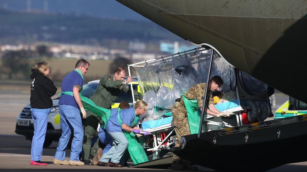 Pauline Cafferkey being transported onto plane