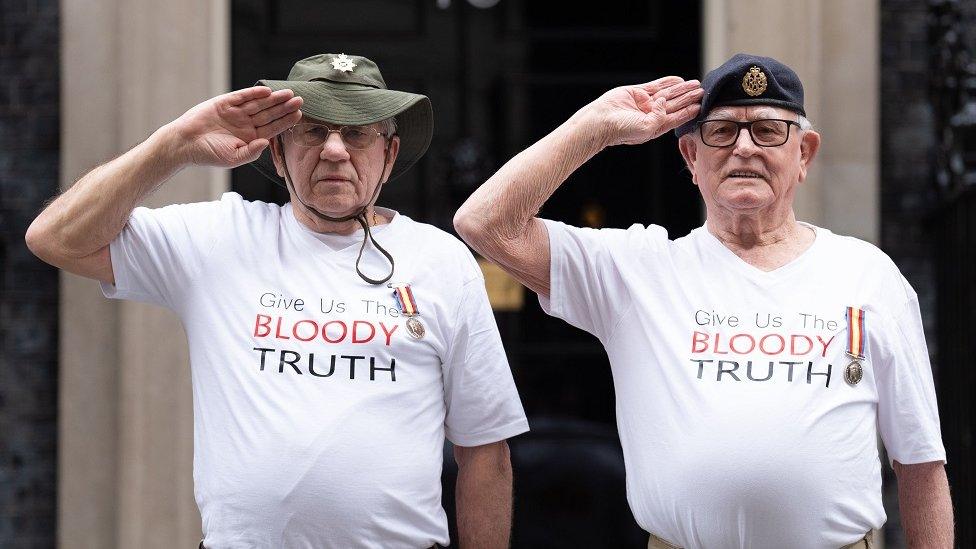 Veterans Terry Quinlan and Brian Unthank salute in front of 10 Downing Street