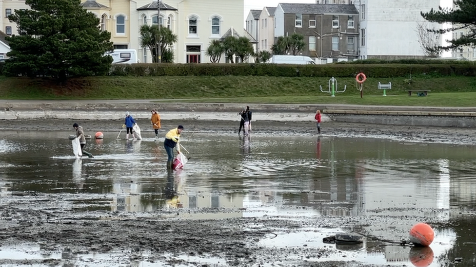 Beach Buddies volunteers in the drained Mooragh Lake