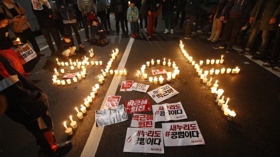 Candles spell out "President Park Geun-hye Step Down"