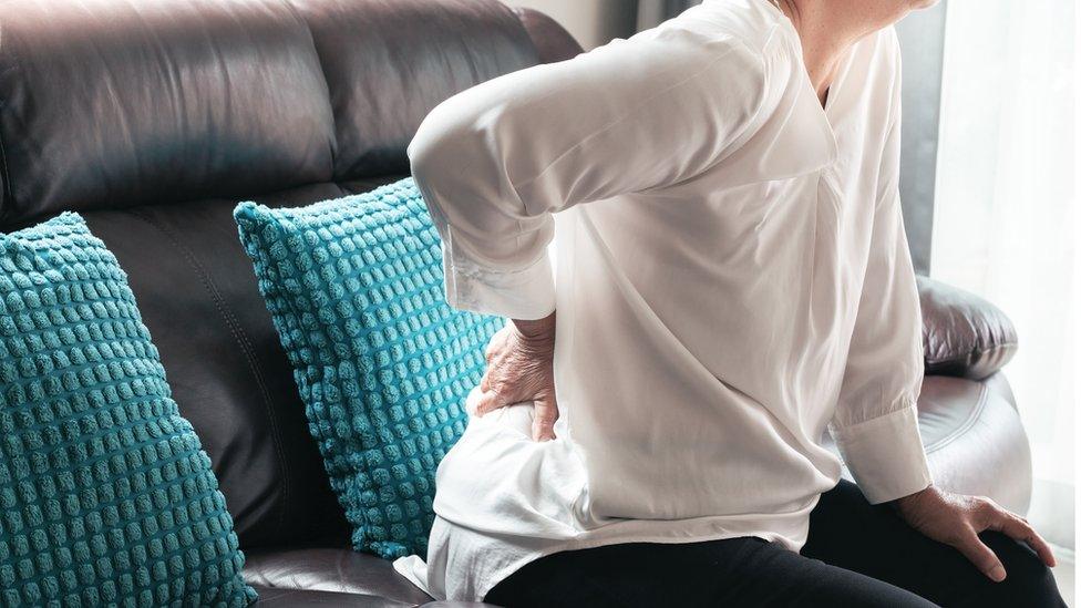 Woman with a sore back