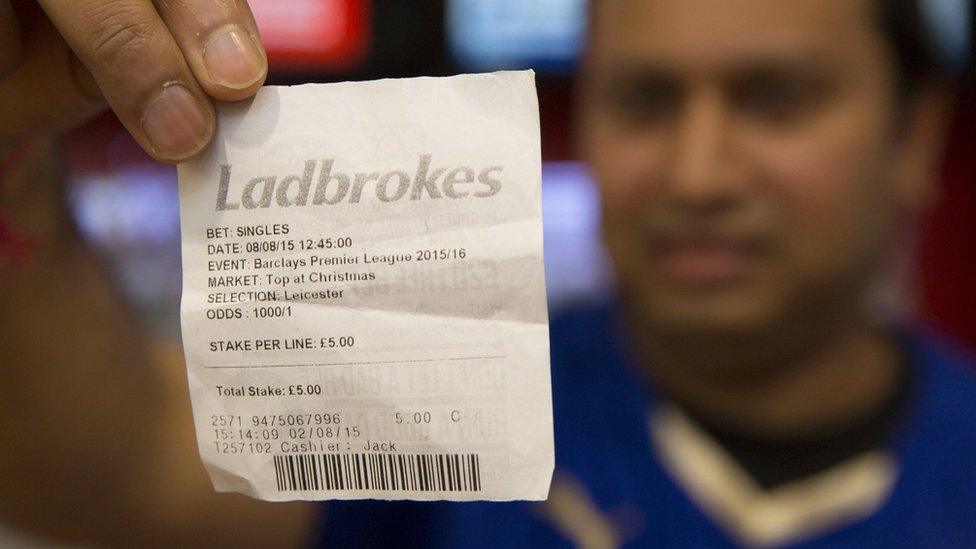 Leicester fan with betting slip