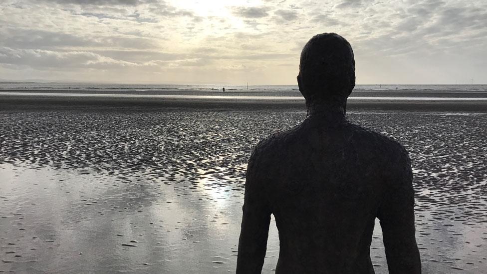 Iron statue on beach